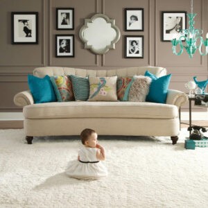Cute baby sitting on carpet floor | Carpet Collection