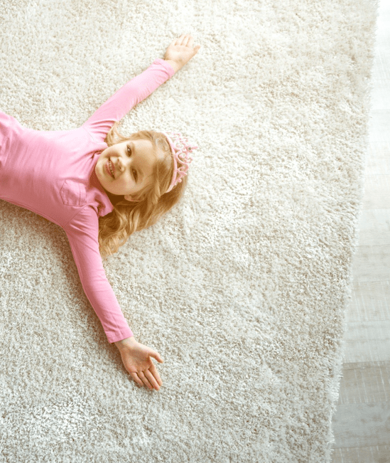 Cute girl laying on rug | Carpet Collection