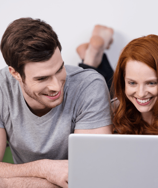 Happy couple with laptop | Carpet Collection